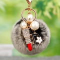 Faux fur pompom keychain with crystal lipstick, pearls, and black letter D charm - D Letter Lipstick Frosted Pom Pom