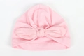 Dettaglio del cappello a turbante per neonati in rosa chiaro con grande fiocco decorativo - Rosa Chiaro