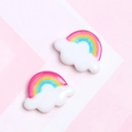 Close-up of cute resin rainbow cloud charms for DIY phone cases and craft projects - Rainbow