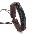 Detail shot of brown leather woven bracelet with black metal feather and adjustable cord - Brown