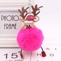 Detail of a plush Christmas reindeer pom-pom keychain with red hat and golden antlers - Rose Red