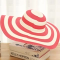 Summer beach straw hat featuring red and white stripes and a wide wavy brim on a stand - One Size (Adult) / Red Stripes