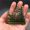 Detailed close-up of a bronze metal Barcelona Sagrada Familia 3D souvenir fridge magnet - Barcelona Spain