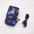 Dark blue crossbody phone bag with colorful floral prints and adjustable strap - Circular Drawing