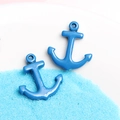 Blue anchor-shaped resin charms displayed on sand for DIY phone case craft decoration - Dark Blue Anchor