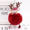 Dettaglio di un portachiavi a forma di renna con pompon rosso e corna in pelle con anello - Borgogna