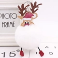 Detail of Christmas reindeer keychain with white faux fur pompom and red hat - White