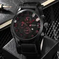 Close-up of KTEVI black chronograph watch with red hands and leather strap on mesh desk - Black Strap Red Numbers
