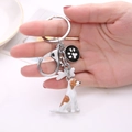 Metal beagle dog keychain with black paw print charm and spring buckle accessory - Beagle