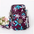 Vertical floral phone crossbody bag in purple with multiple zippered compartments - Blue Enchantress