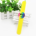 Yellow silicone slap bracelet with a rainbow striped heart smiley face design - Yellow Smiley Face
