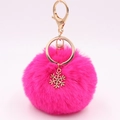 Detail of rose red fluffy pompom keychain with golden snowflake charm and clasp - Rose Red