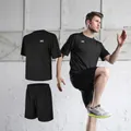 Detail of men's black quick-dry sports set with breathable t-shirt and loose shorts - S / Top And Bottom / Black