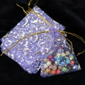 Purple organza gift bag with gold star and moon patterns and drawstring closure - Light Purple