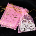 Pink sheer organza gift pouch with gold moon and star pattern for jewelry storage - Pink