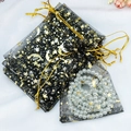 Black organza jewelry pouch with gold star moon patterns and white pearl beads - Black