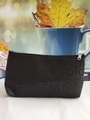 Detail of black fabric toiletry bag with silver zipper and COIGNE letter jacquard pattern - Black