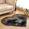 Dark grey heart shaped plush area rug in a cozy living room scene on wooden floor - Dark Gray
