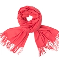 Solid coral red cashmere-feel scarf with fringe details shown on white background - Watermelon red