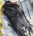 Thick black mohair scarf with chunky tassels for a cozy and minimalist winter style - Black