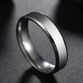 Polished 6mm stainless steel flat band ring with bevelled edges on a dark texture - US 5 / Steel