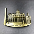 Close-up of 3D bronze metal Vatican City souvenir magnet with St. Peter's Basilica - Vatican City