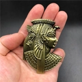 Detailed macro view of 3D embossed antique gold Egyptian Pharaoh metal fridge magnet - Egyptian Pharaoh