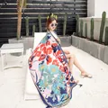 Close-up of lightweight floral cotton linen shawl with fringe edges for beach vacation - Blue Loving Floral