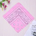Pink paisley sports bandana with vintage cashew pattern on light wood background - Pink