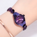 Elegant purple dial ladies watch with rose gold metal bracelet worn by a model - Purple