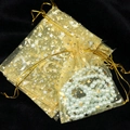 Golden organza gift bags with star moon pattern and pearl necklace inside on velvet - 9*12cm / Gold