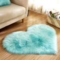 Turquoise heart-shaped plush rug made of soft faux fur on a wooden floor in a living room - Light Blue