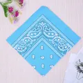 Blue paisley cotton sports bandana with classic white pattern on light wood background - Lake Blue