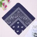 Navy blue paisley bandana with classic cashew flower print on rustic wood background - Navy Blue