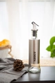 Glass and stainless steel oil dispenser bottle with sauce label for kitchen use - Sauce
