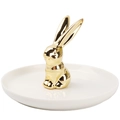 Detail of a white ceramic jewelry tray featuring a polished gold rabbit statuette - Gold White Rabbit Stand