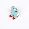 Cute light blue enamel sock pin badge with red star patterns and metallic finish - Socks