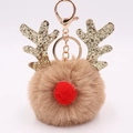 Plush sequin reindeer keychain with gold antlers and red pompom nose on white background - Khaki