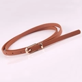 Slim brown leather belt for dresses with golden D-ring buckle on white reflective base - Camel