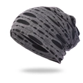 Detailed macro view of the distressed knit texture and hole design on this slouchy beanie - One Size / Gray