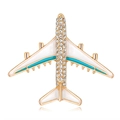 Elegant gold airplane brooch with sparkling rhinestones and white enamel finish - Gold Airplane Style (C504-A)