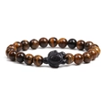 Natural tiger eye stone beaded bracelet featuring a matte black turtle charm accessory - Tiger Eye Stone Bracelet