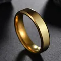 Macro shot of 6mm polished gold stainless steel ring band with precision beveled edges - US 5 / Gold