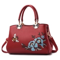 Elegant red faux leather handbag featuring blue floral embroidery and a bee accent - Style A Single Bee Wine Red