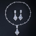 Detail of bridal jewelry set with teardrop zircon necklace and matching earrings - Stud Pin Style / White