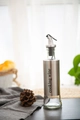 Glass and stainless steel cooking wine bottle with a silver pump and black stopper - Cooking Wine