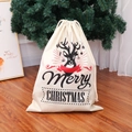 Burlap Christmas drawstring gift bag with reindeer print on wooden floor background - Type A Printed Linen Bag (Black Reindeer/Red Ribbon)