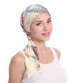 Detail of floral printed headscarf showing the long tail ties and colorful leaf patterns - Beige