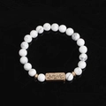 White marble bead bracelet with Active engraved bronze charm on black background - White Marble (Active)