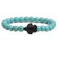 Lapis turquoise beaded bracelet featuring a black matte sea turtle charm centerpiece - Turquoise